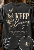 Keep Becoming graphic tee by Different Cloth Co. in Pepper featuring botanical artwork, signature front chest logo, and the message Some people aren't meant to come with you.